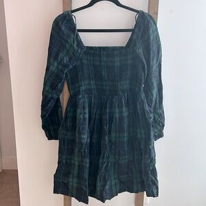 Blue and green plaid mini dress with smocked top and long sleeves